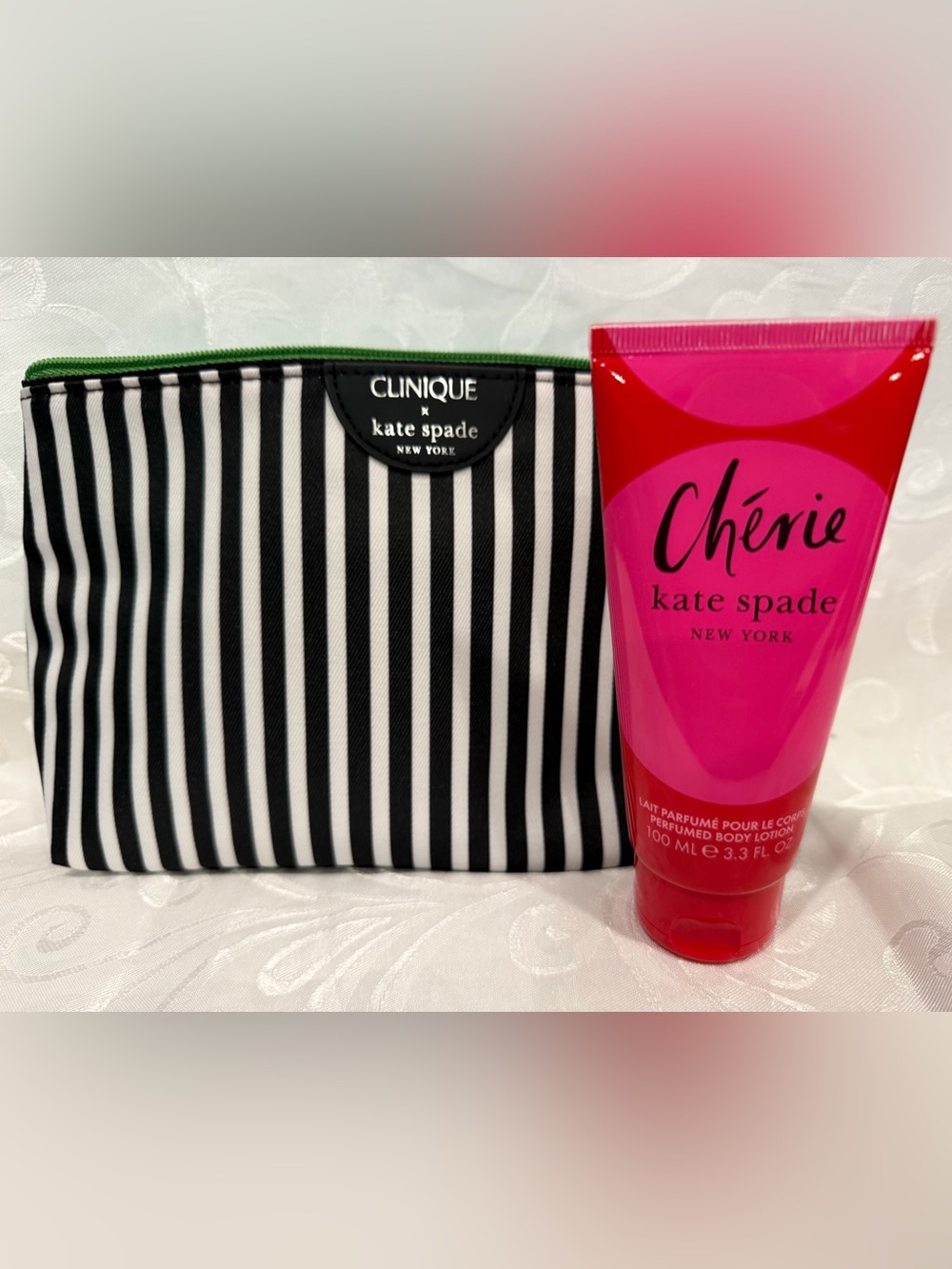 kate spade Cosmetic Bag and Cherie Perfumed Lotion. New